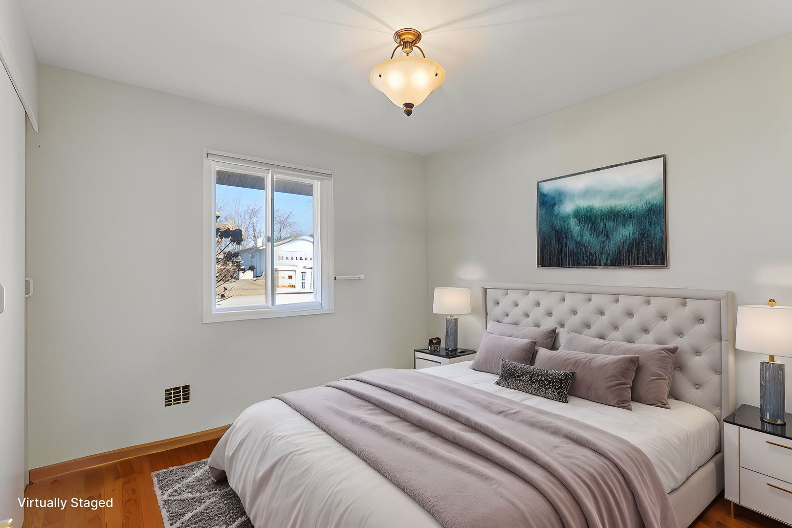 875 West Firestone Drive Hoffman Estates, IL 60192 - Photo 10 of 16 a bedroom with a bed and a lamp