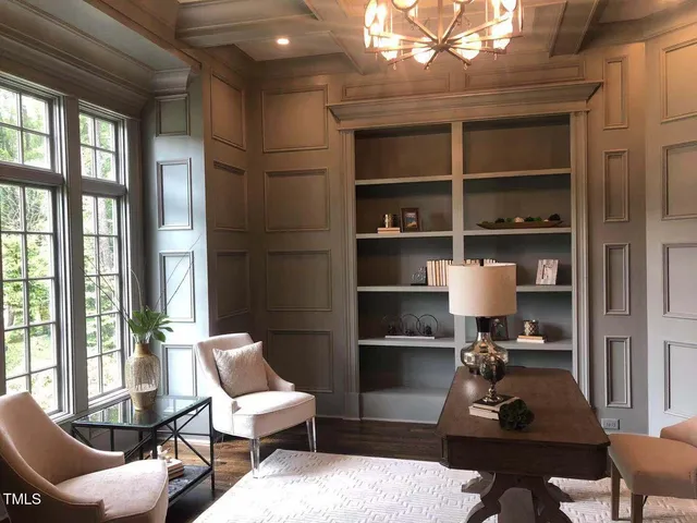 a room with furniture a rug and a window