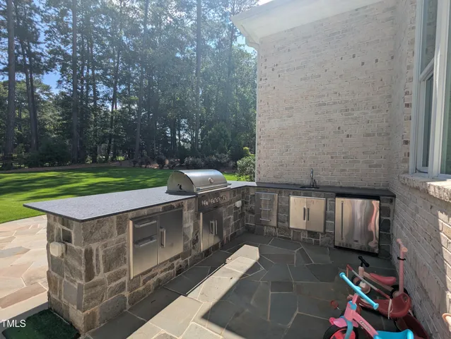 a view of a couches with wooden fence