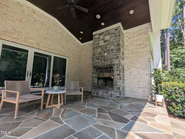 a building with table and chairs in front of it