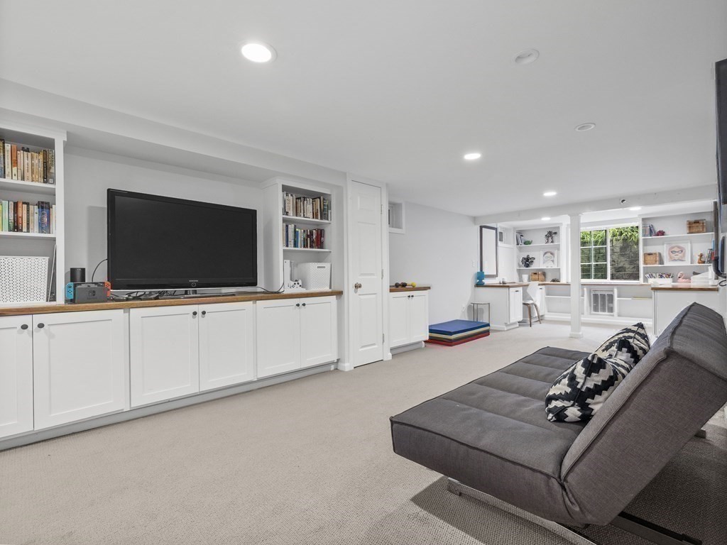 22 Cavanagh Road Wellesley, MA 02481 - Photo 16 of 21 a living room with furniture and a flat screen tv