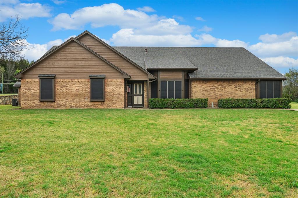 5840 Crystal Drive Midlothian, TX 76065 - Photo 33 of 36 a front view of house with yard and green space