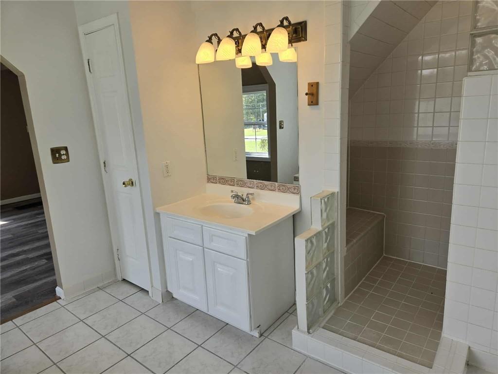 2907 Oneida Valley Road Hilliards, PA 16040 - Photo 21 of 42 a bathroom with a sink vanity and a mirror