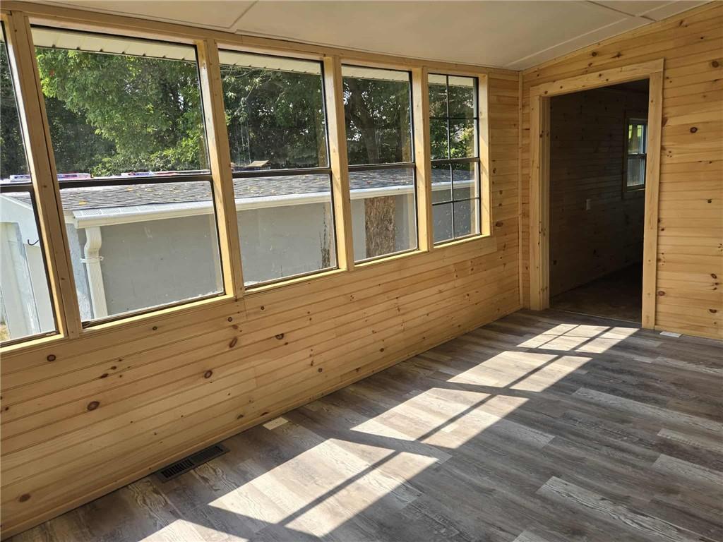 2907 Oneida Valley Road Hilliards, PA 16040 - Photo 3 of 42 a view of an empty room with wooden floor and a window