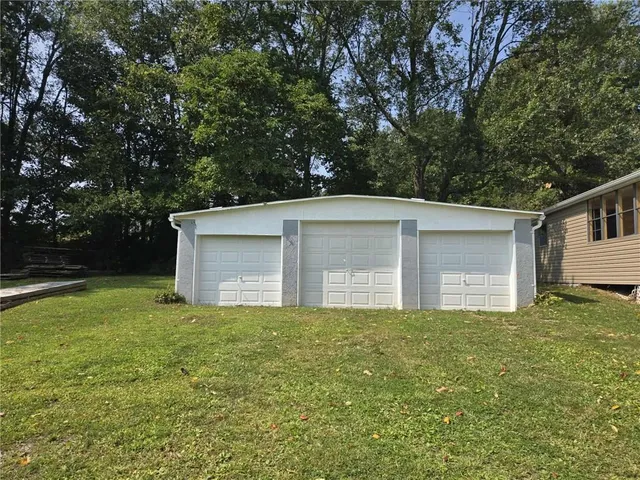 a room with water heater and a wooden floors