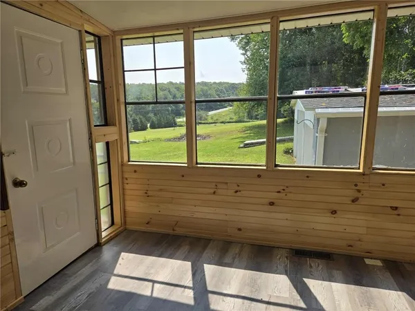 a view of a room that has a bed