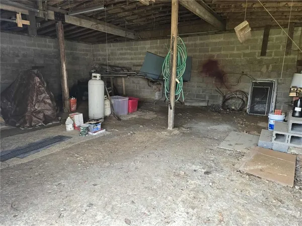 a view of a small house in the middle of a yard