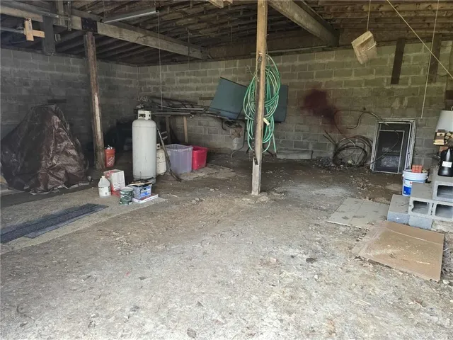 a view of a small house in the middle of a yard