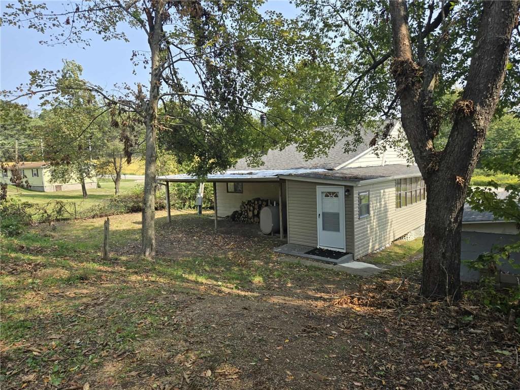 2907 Oneida Valley Road Hilliards, PA 16040 - Photo 42 of 42 a view of a small house in the middle of a yard