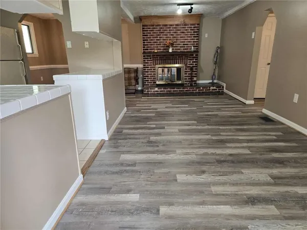 a view of an entryway with fireplace
