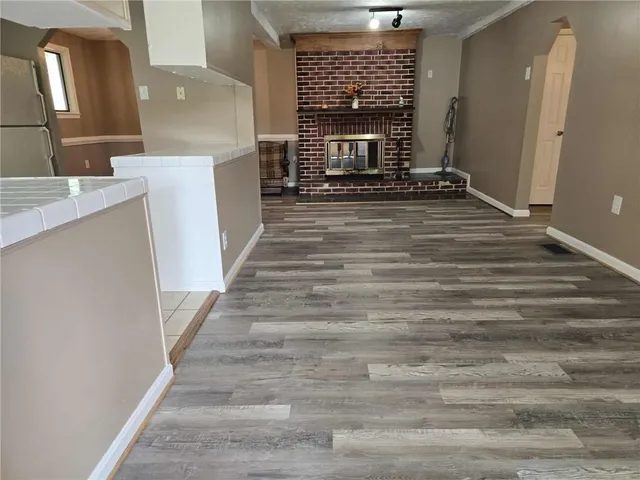 a view of an entryway with fireplace