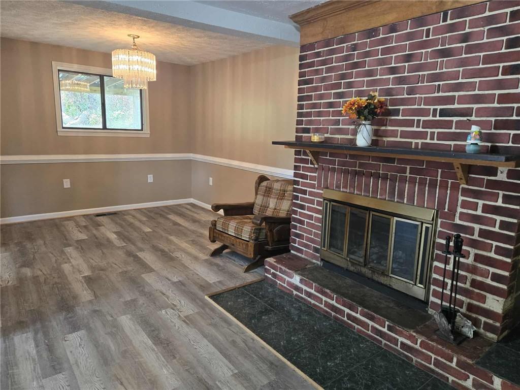 2907 Oneida Valley Road Hilliards, PA 16040 - Photo 8 of 42 a living room with a fireplace
