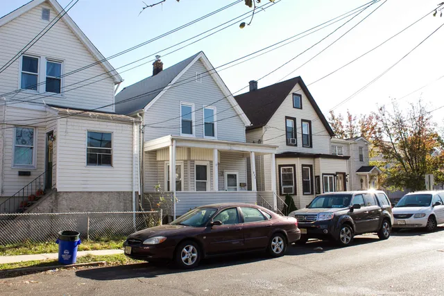 a view of a car parked in front of a house