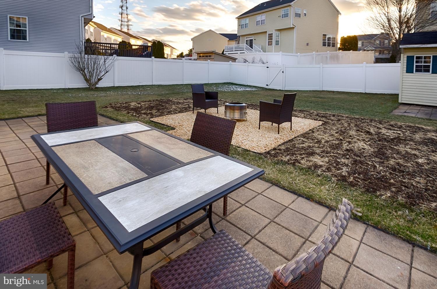15 Greenbrook Drive Columbus, NJ 08022 - Photo 24 of 24 a view of a patio with table and chairs with wooden floor