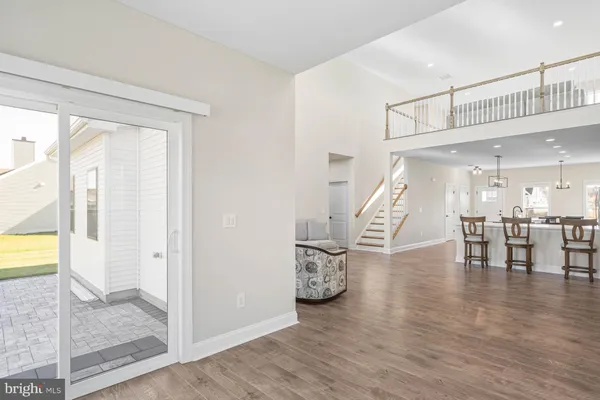 a view of a livingroom with furniture and hardwood floor