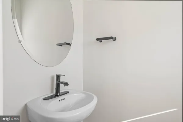 a bathroom with a sink and mirror