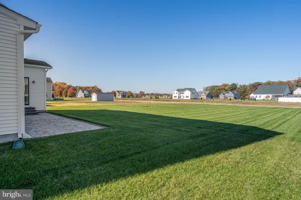 a view of a golf course with a big yard