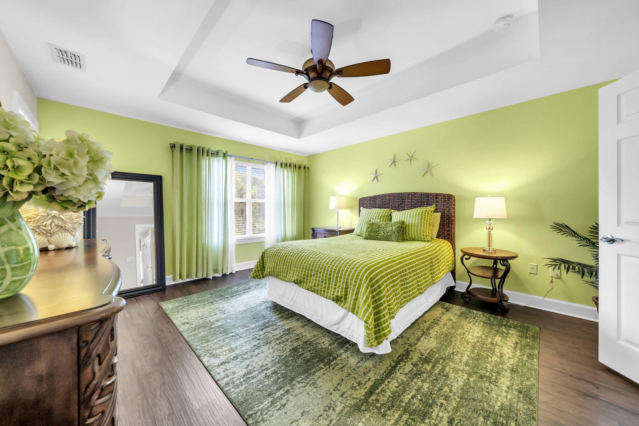 159 Golden Eagle Court, Unit 3C Santa Rosa Beach, FL 32459 - Photo 24 of 34 a bedroom with a bed and a chandelier