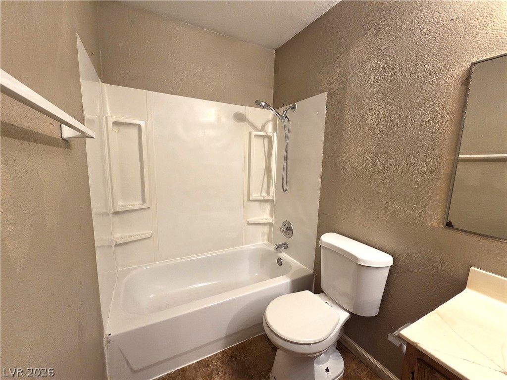 2882 Sandyfalls Way Las Vegas, NV 89142 - Photo 9 of 18 A well-maintained full bathroom featuring a tub/shower combination and functional vanity.