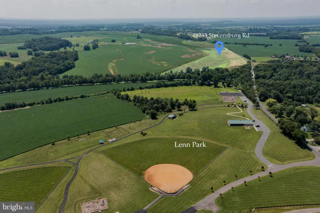 an aerial view of a golf course with a swimming pool