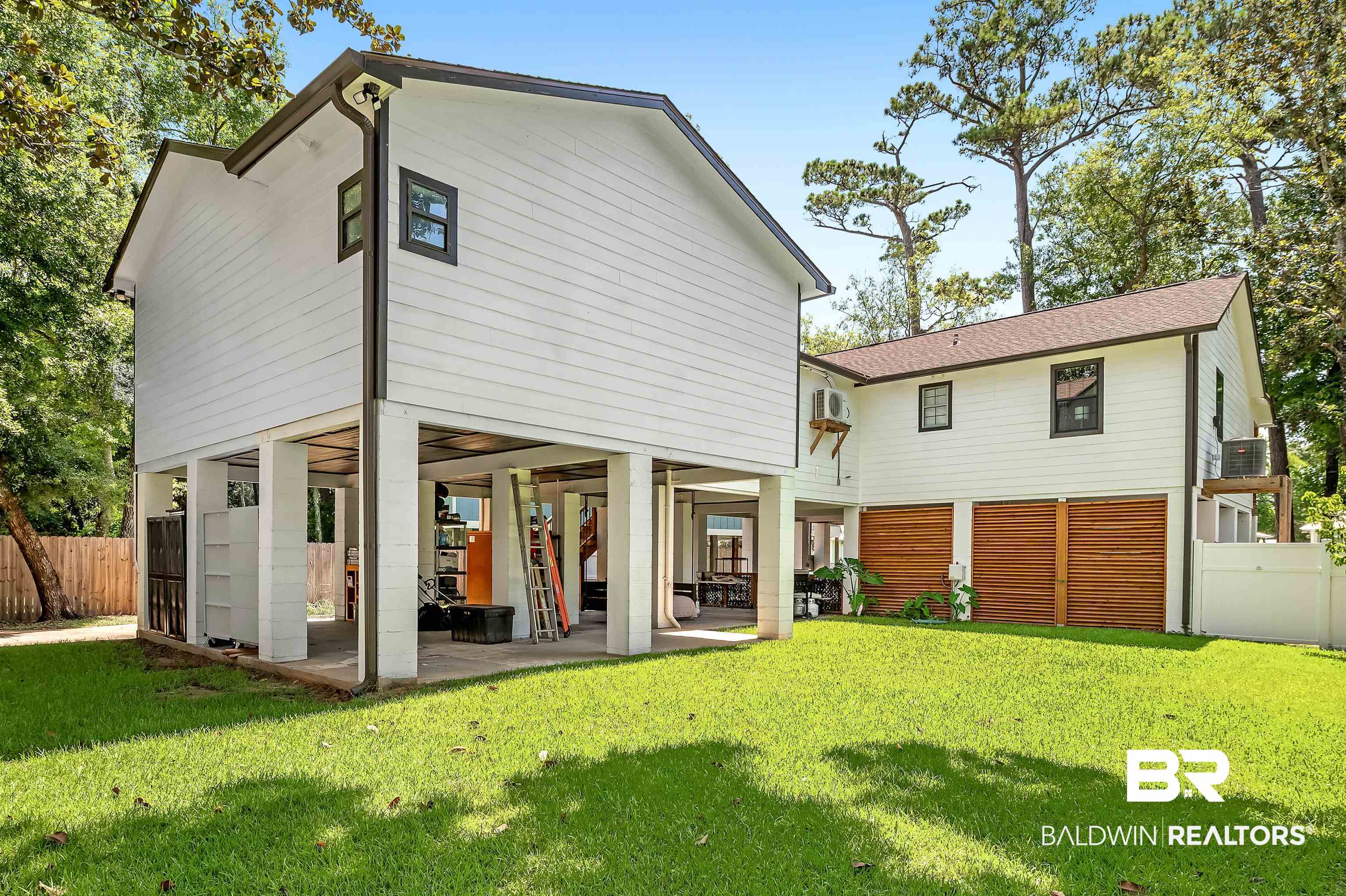 5215 Pine Road Orange Beach, AL 36561 - Photo 54 of 60 Rear view of house with a patio
