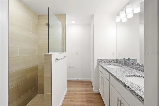 a bathroom with a sink toilet and shower