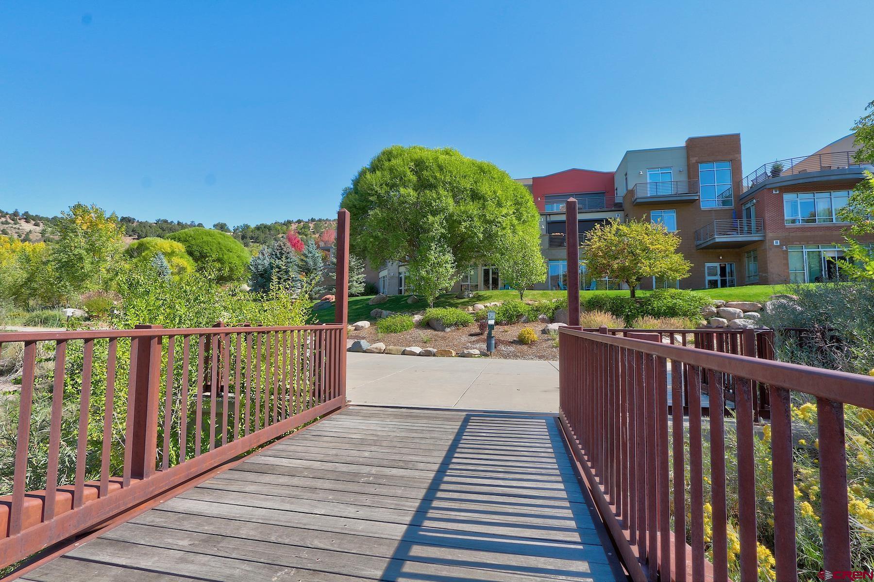555 Rivergate Lane, Unit B482 Durango, CO 81301 - Photo 12 of 35 a view of a balcony with wooden floor and fence