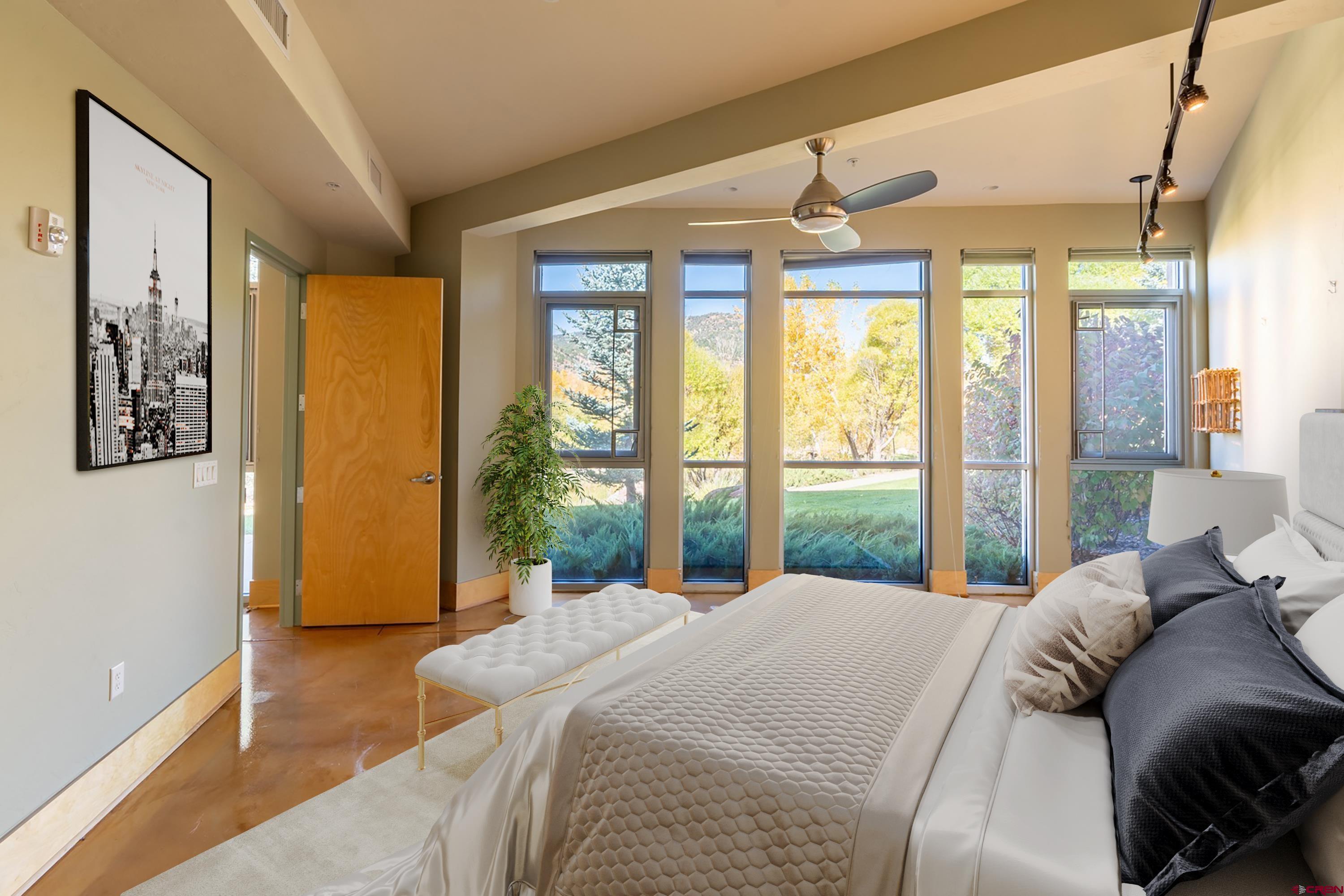 555 Rivergate Lane, Unit B482 Durango, CO 81301 - Photo 14 of 35 a bedroom with a large bed and a large window