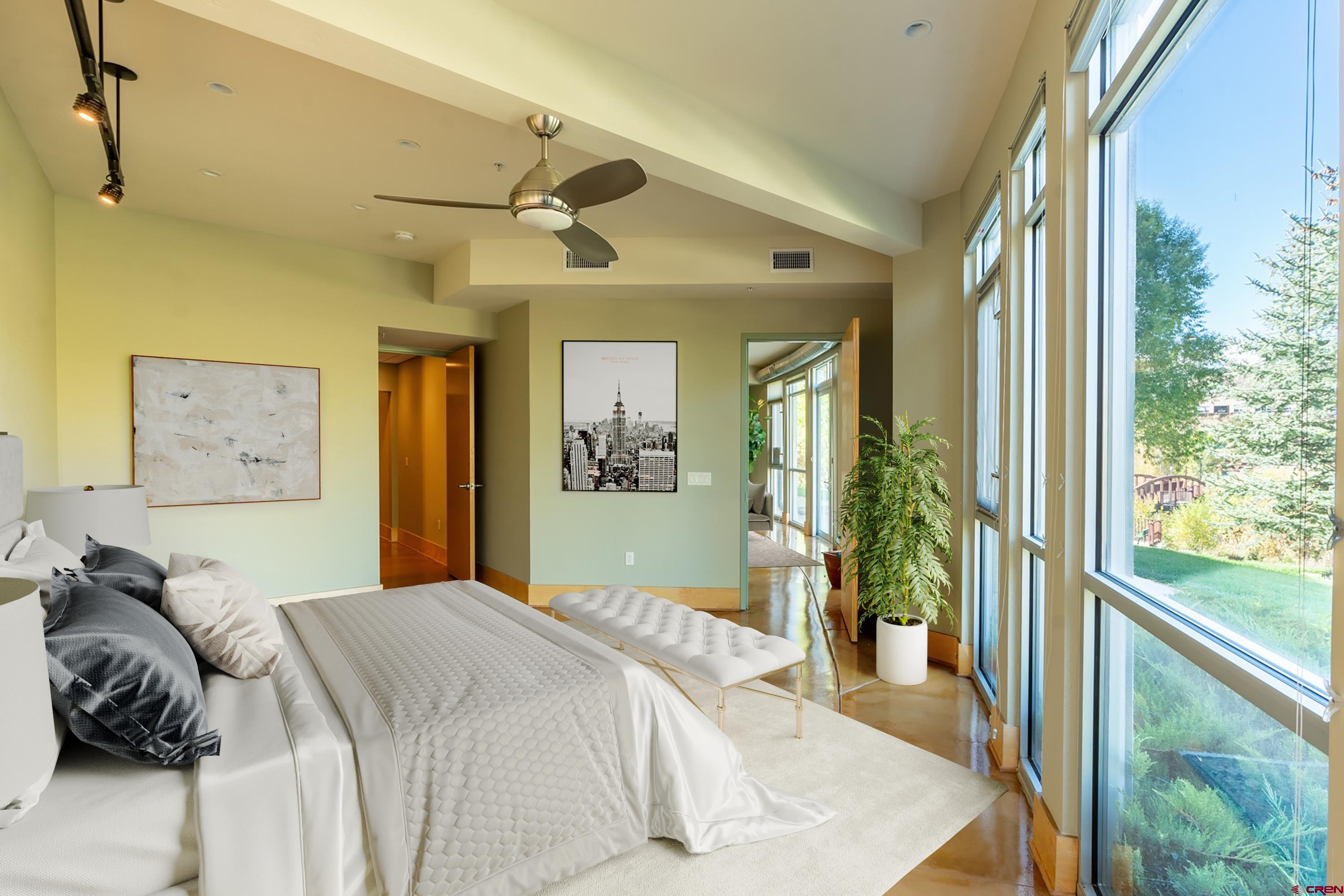 555 Rivergate Lane, Unit B482 Durango, CO 81301 - Photo 15 of 35 a bedroom with a bed and a large window