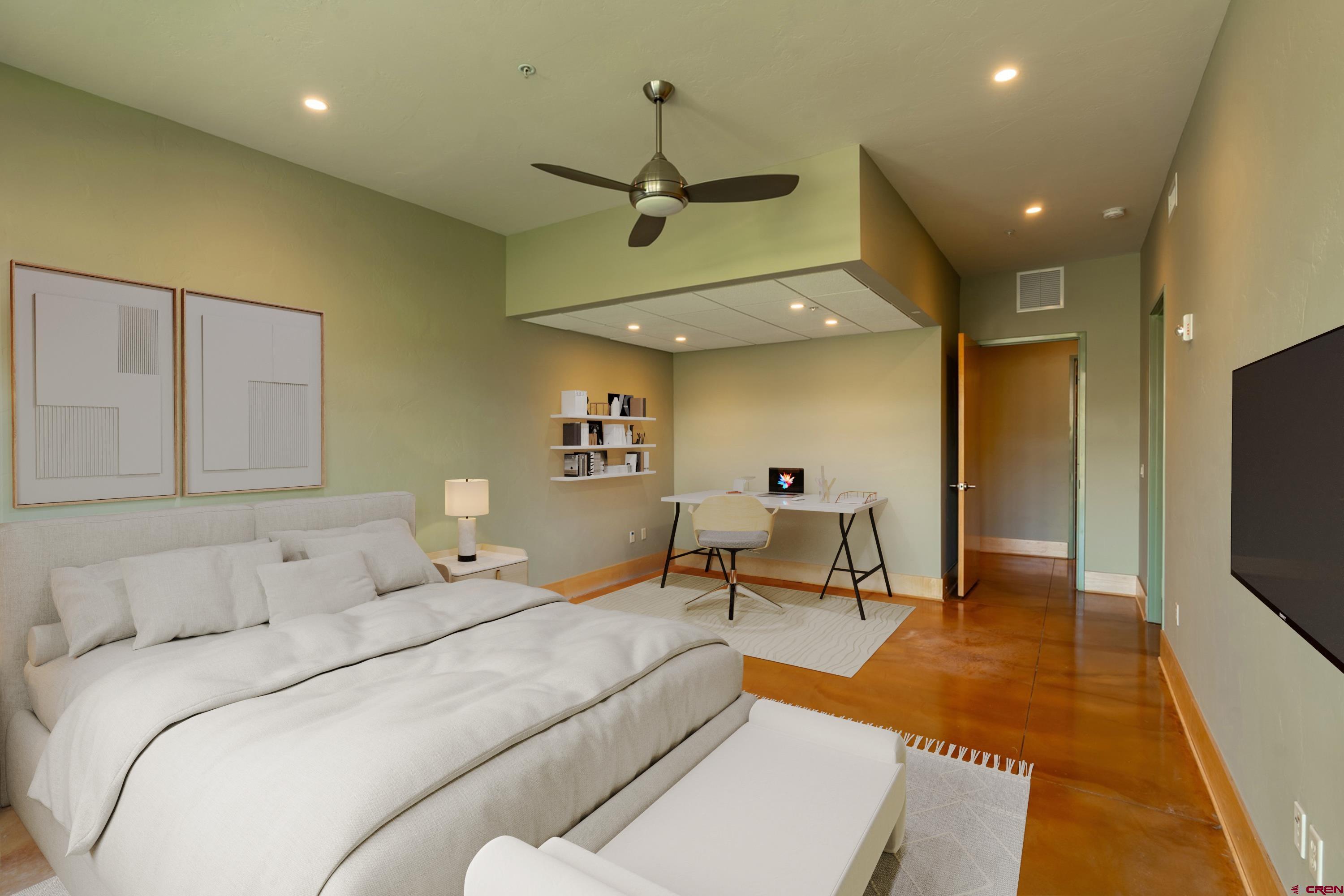 555 Rivergate Lane, Unit B482 Durango, CO 81301 - Photo 16 of 35 a bedroom with a bed a couch and a flat screen tv