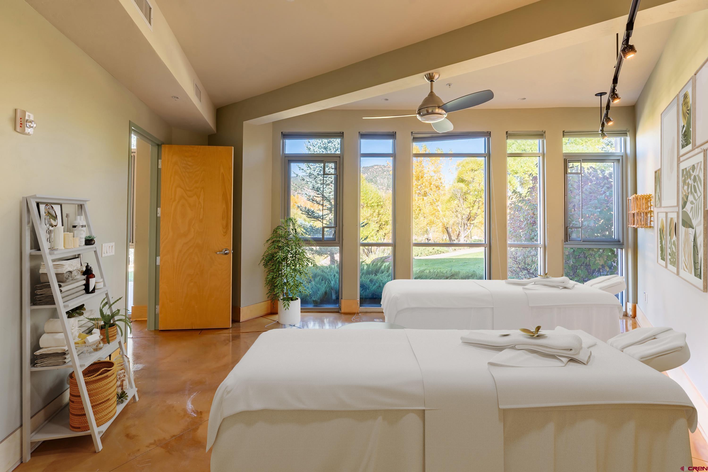 555 Rivergate Lane, Unit B482 Durango, CO 81301 - Photo 18 of 35 a spacious bedroom with a bed and a large window