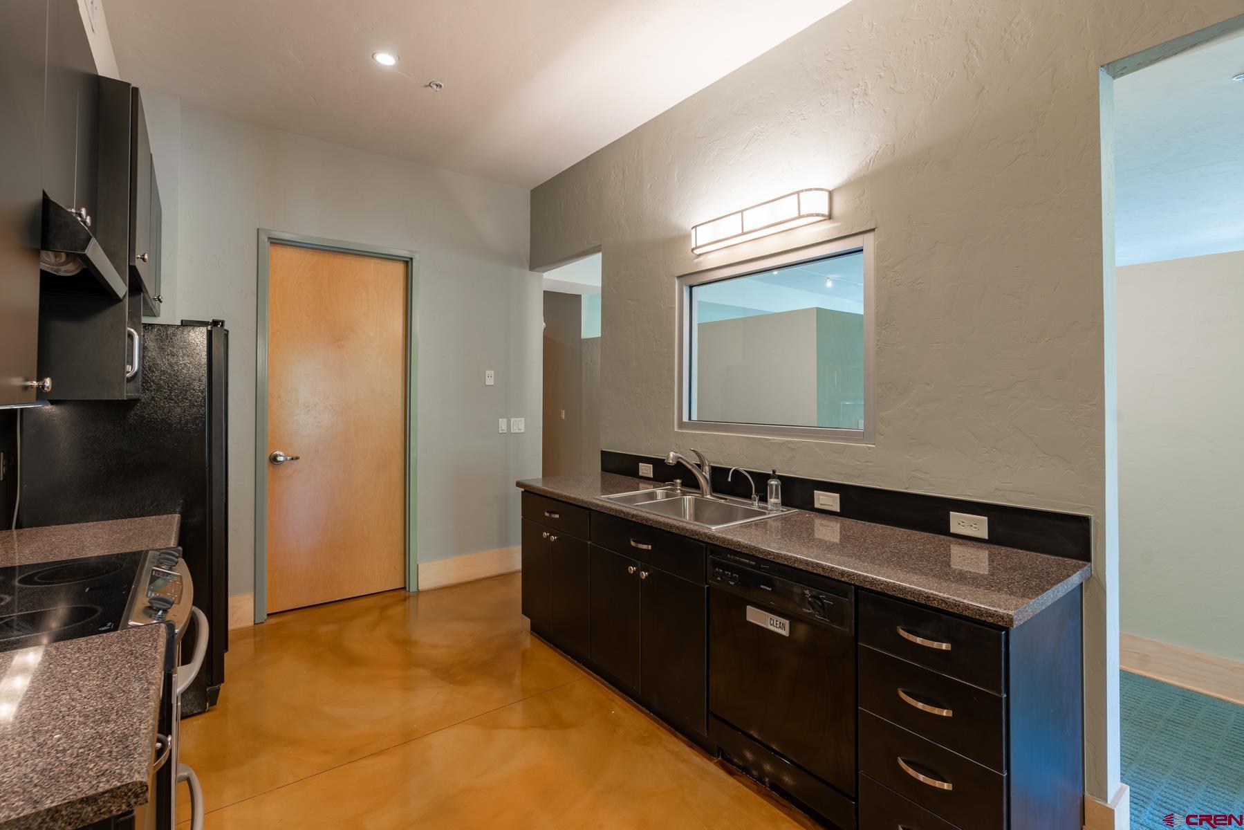 555 Rivergate Lane, Unit B482 Durango, CO 81301 - Photo 26 of 35 a bathroom with a double vanity sink and mirror