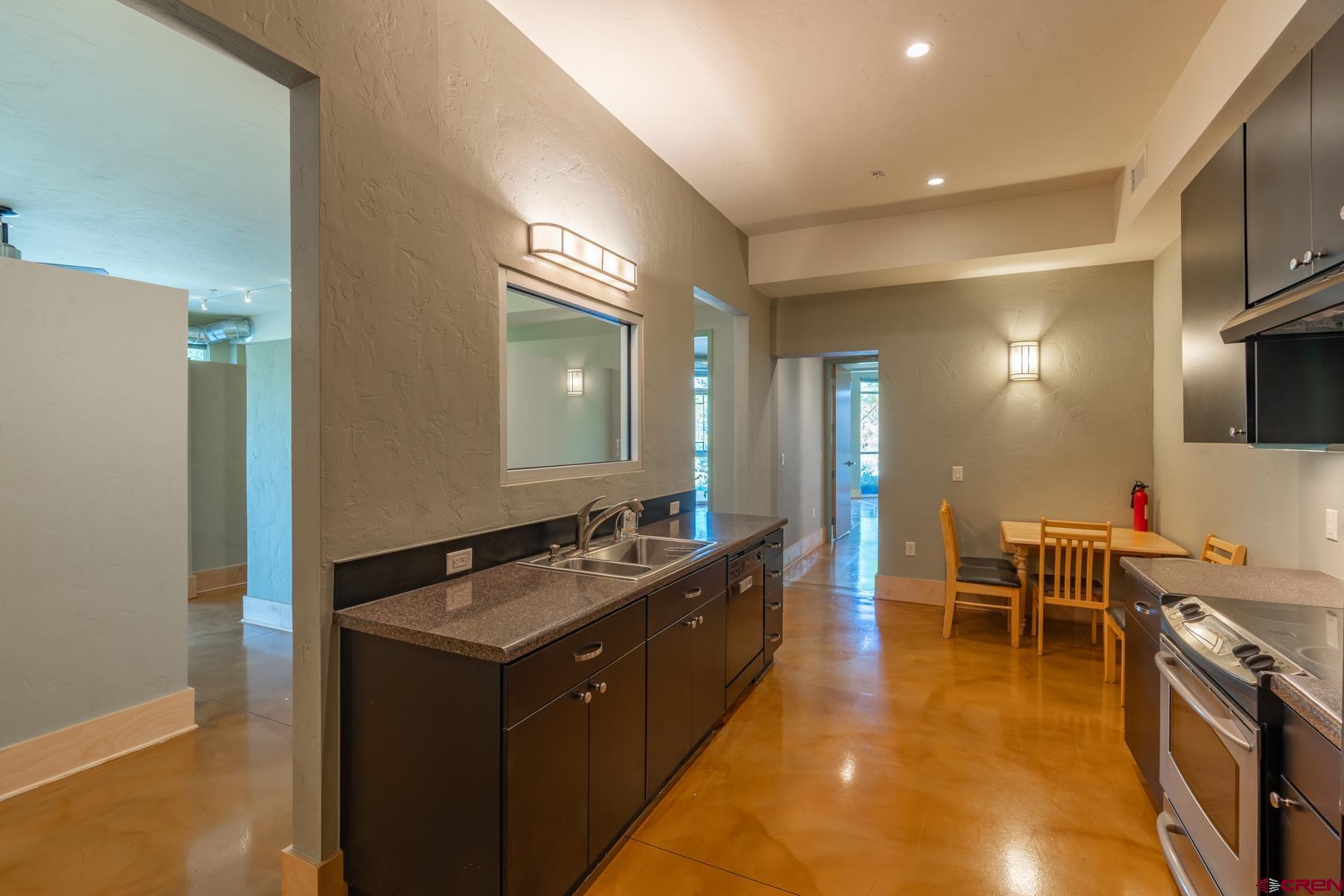 555 Rivergate Lane, Unit B482 Durango, CO 81301 - Photo 28 of 35 a kitchen with a stove and a sink