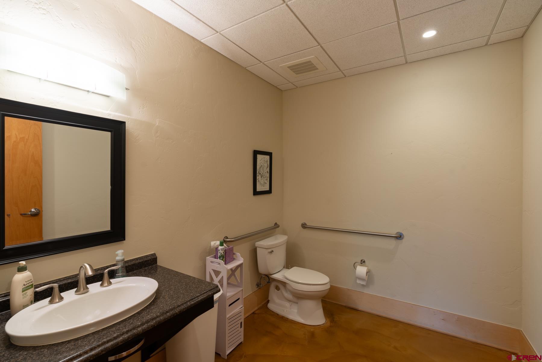 555 Rivergate Lane, Unit B482 Durango, CO 81301 - Photo 31 of 35 a bathroom with a sink toilet and mirror