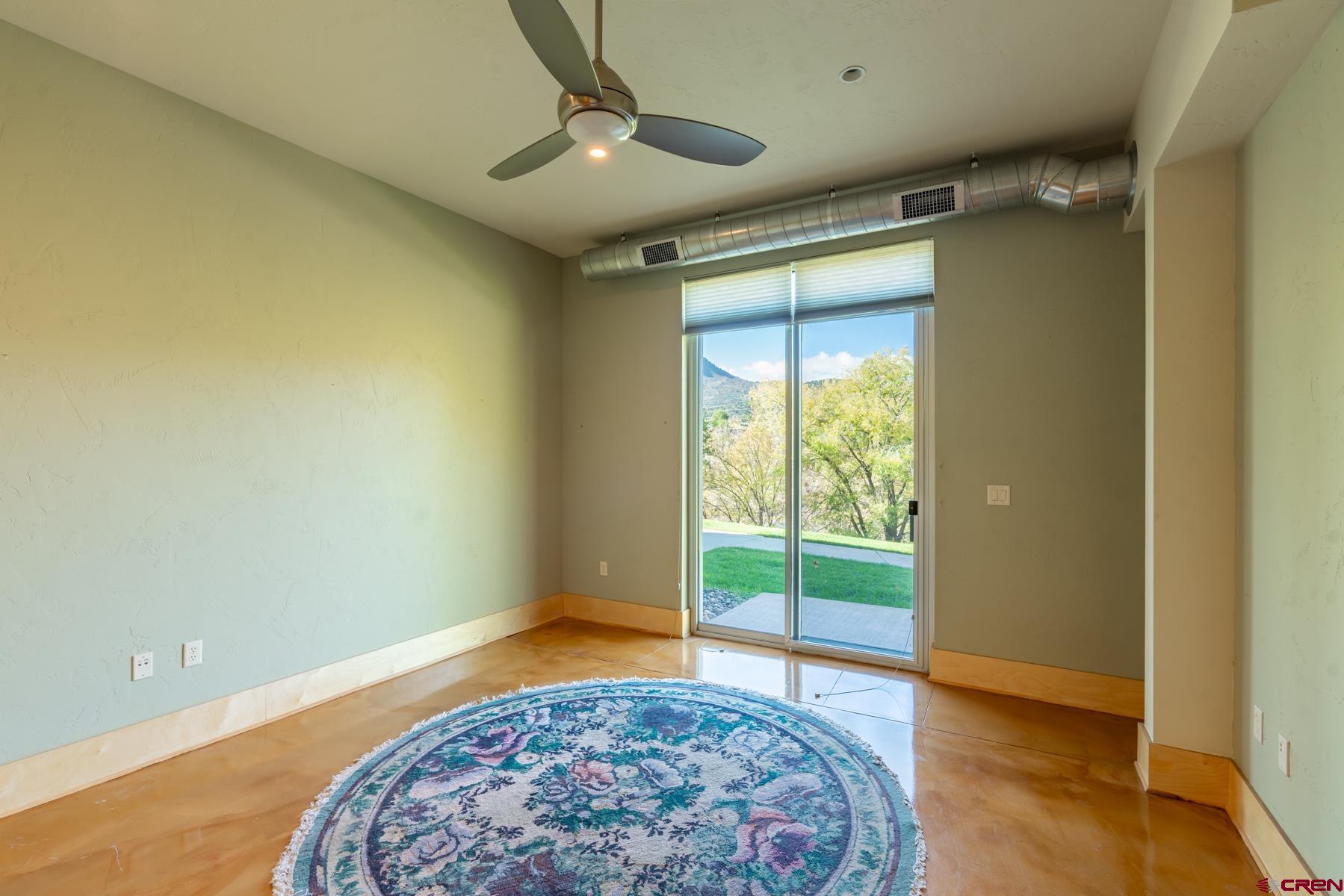 555 Rivergate Lane, Unit B482 Durango, CO 81301 - Photo 32 of 35 a bedroom with a bed and a window