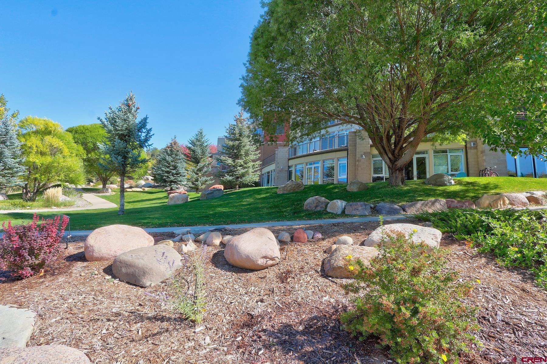 555 Rivergate Lane, Unit B482 Durango, CO 81301 - Photo 9 of 35 a backyard of a house with yard and outdoor seating