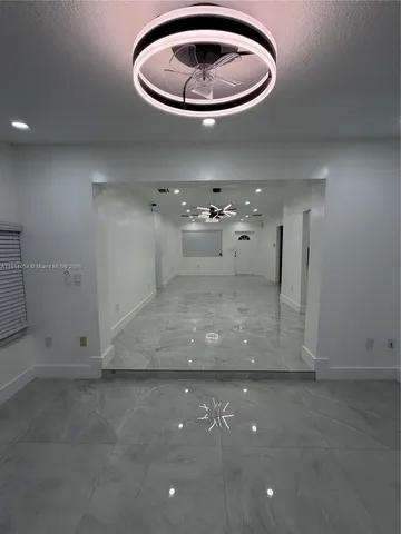 a very nice looking room with a air conditioner and toilet