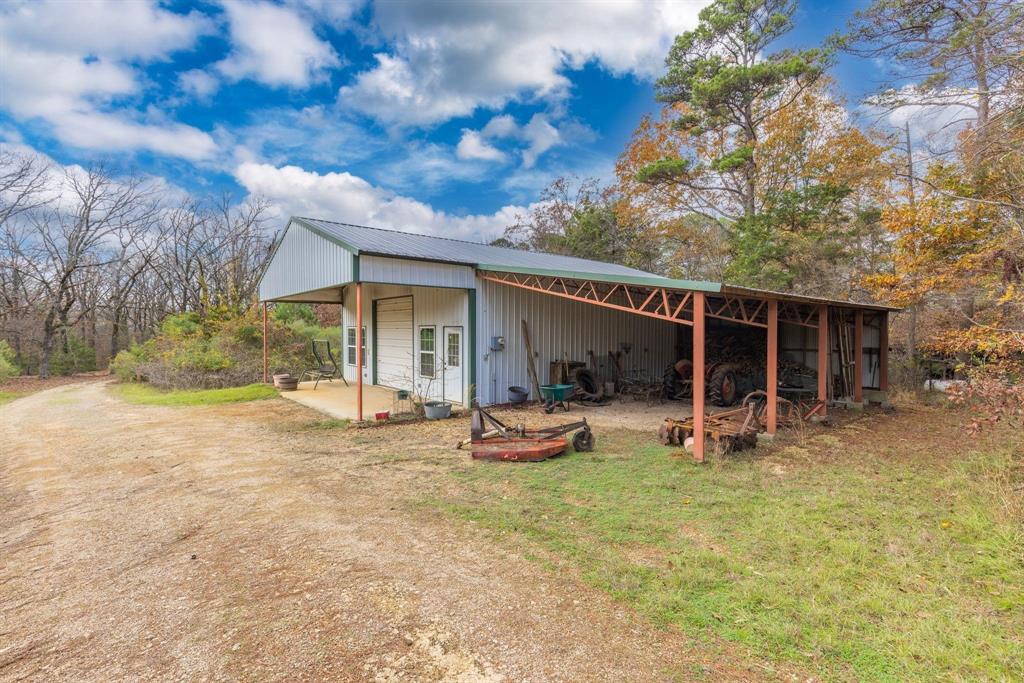 648 County Road 2337 Pittsburg, TX 75686 - Photo 17 of 21 a view of a house with backyard and sitting area