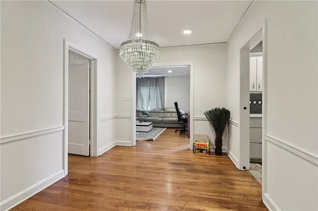 a view of a room with dining table and wooden floor
