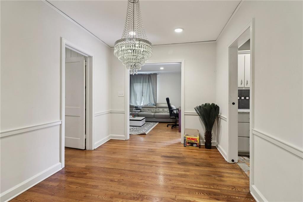 2267 Melante Drive Northeast Atlanta, GA 30324 - Photo 11 of 39 a view of a room with dining table and wooden floor