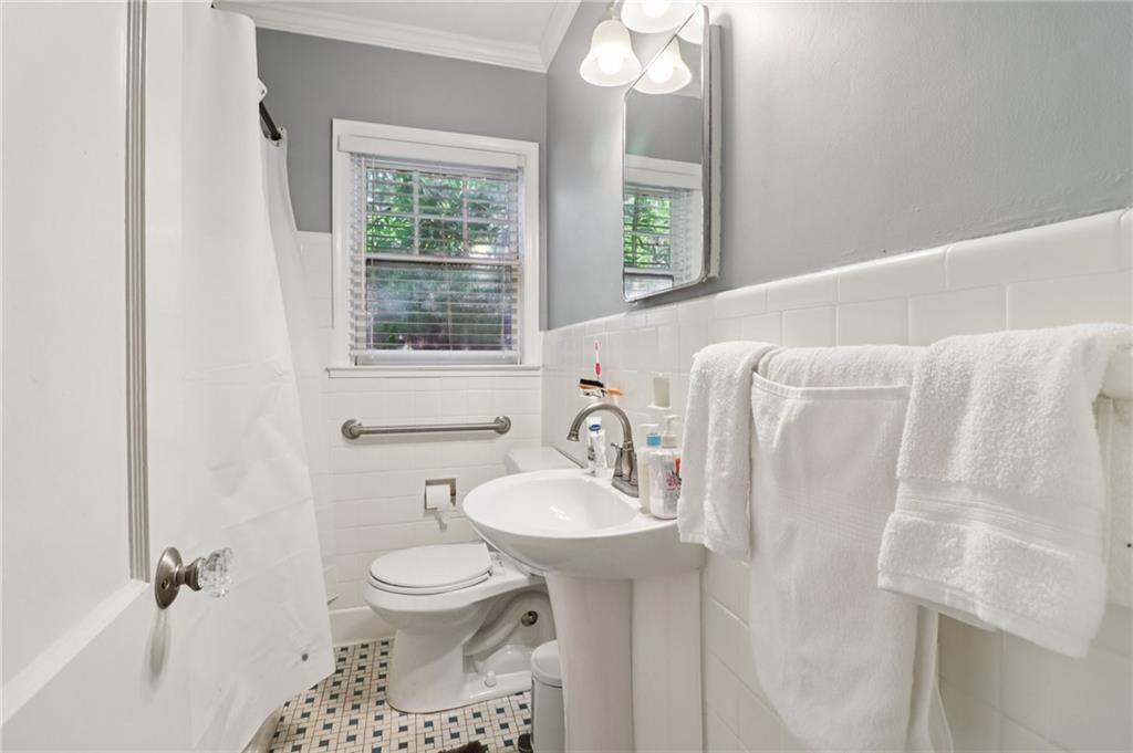 2267 Melante Drive Northeast Atlanta, GA 30324 - Photo 18 of 39 a bathroom with a sink toilet and a mirror