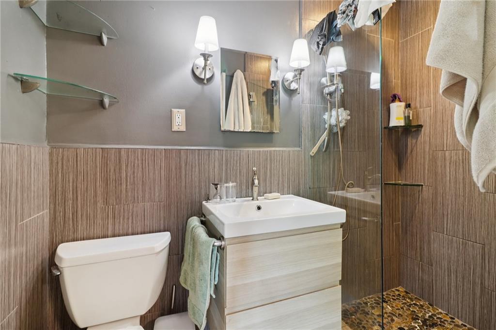 2267 Melante Drive Northeast Atlanta, GA 30324 - Photo 22 of 39 a bathroom with a sink a toilet and shower