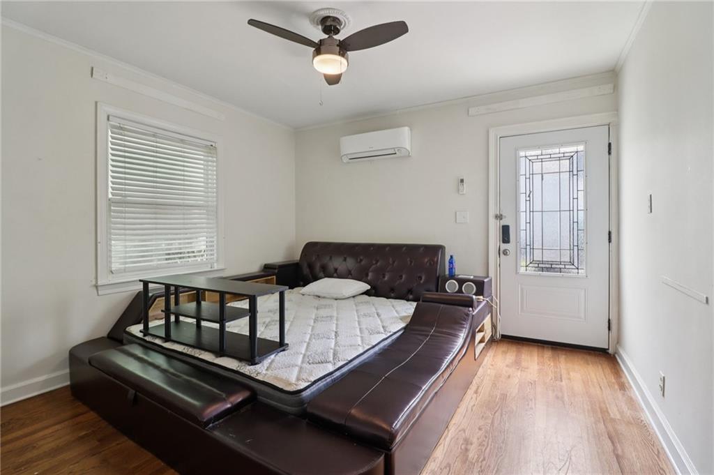 2267 Melante Drive Northeast Atlanta, GA 30324 - Photo 23 of 39 a living room with a bed furniture and a window