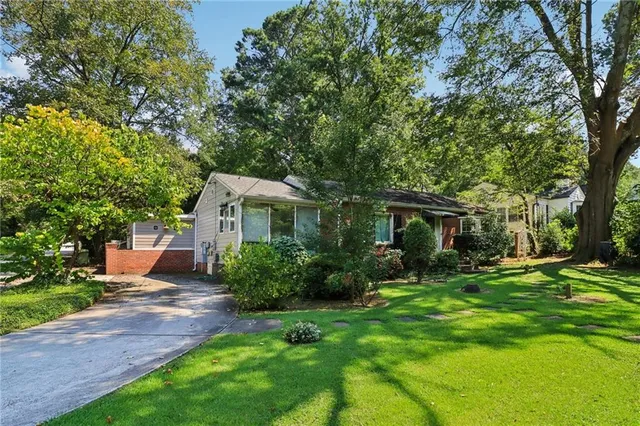 a front view of a house with garden