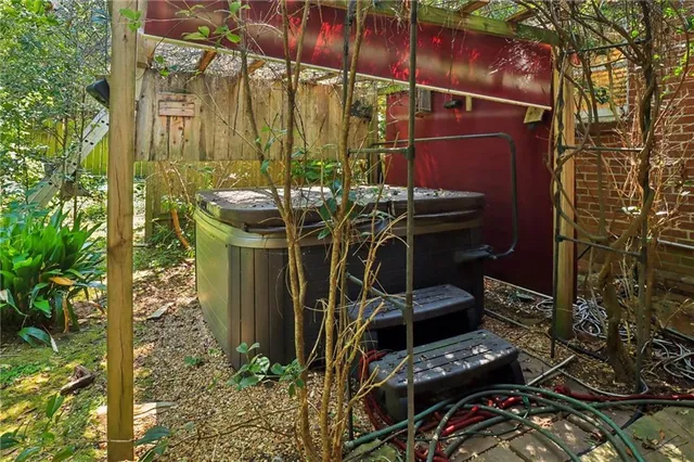 a view of a balcony with chairs and potted plants