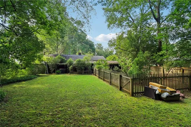 a view of a garden with houses
