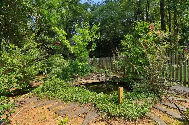 a backyard of a house with lots of green space