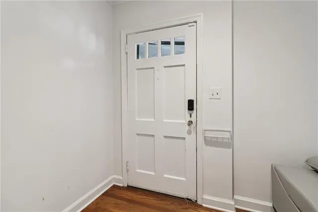 an empty room with wooden floor