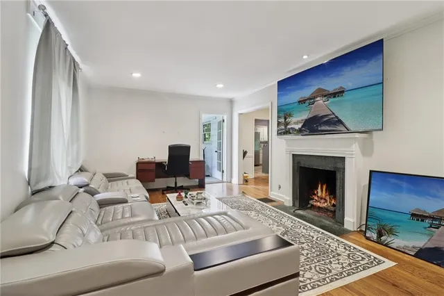 a living room with furniture and a fireplace