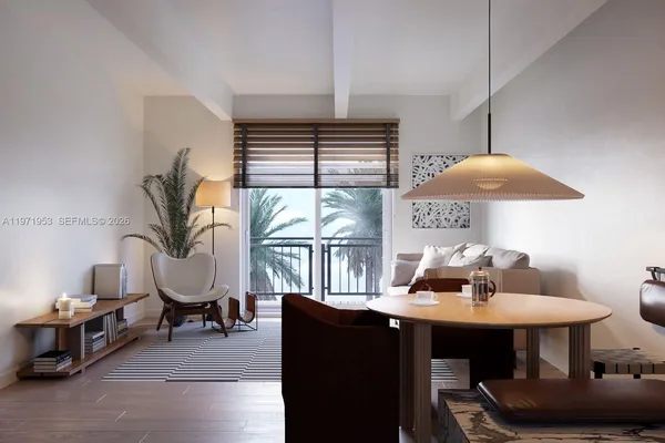 a living room with furniture a window and a chandelier